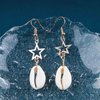 Allereyae Vintage Cowrie Drop Earrings Puka Shell Dangle Earrings Gold Star Dangling Earrings Hollow Star Earrings Jewelry for Women and Girls