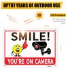 4-Pack 10x7-inch Aluminum UV-Printed Camera Surveillance Signs - Smile Reminder: "You're On Camera!" - High Visibility Safety Warning Plaque for Home & Business Use