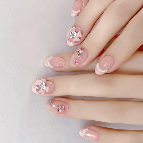 IMSOHOT Oval Press on Nails Pink Short Fake Nails French Tips Acrylic False Nails with Bow Tie Charms Designs Rhinestone Pearl Full Cover Glue on Nails Cute Glossy Nails for Women and Girls 24Pcs