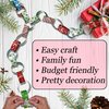 300 Christmas-Themed Paper Chain Strips for Crafting. No Glue or Tape Needed. Kid Friendly & Family Fun. 10 Winter Patterns. Yields Over 50 Feet of Paper Chains for Party Decorations (Christmas)