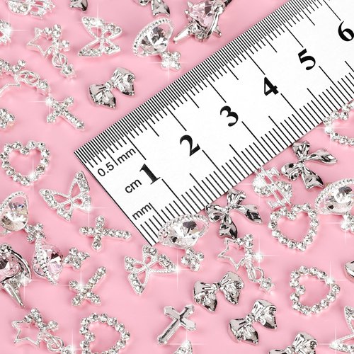 COOSLIM 40pcs Nail Charms Bulk Set with Silver Dollar, Heart,Crosses, Stars, Butterfly, Planets, Bow Nails, ect. 10 Styles Nail Gems Y2k Nail Art Supplies for Women Manicure Decorations 1