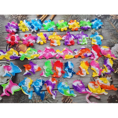 (Birthday Party Favors)100 Packs Bulk Ocean Animal Fidget Mini pop Keychain Rainbow Sensory Push Toy for Friend Halloween Party Favors Children Kids Students Prize Gift