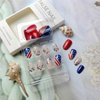 24Pcs 4th of July Press on Nails Short Almond Fake Nails Independence Day Flag with Glitter Star Sequin Design Acrylic Glue on Nails Blue False Nails for Women Girls 4th of July Nails Decoration