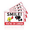 4-Pack 10x7-inch Aluminum UV-Printed Camera Surveillance Signs - Smile Reminder: "You're On Camera!" - High Visibility Safety Warning Plaque for Home & Business Use