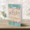 Designer Greetings Christmas Cards - Box Set 18 Cards and 18 Envelopes - Merry Christmas Written in the Sand with Seashells Spelling Merry