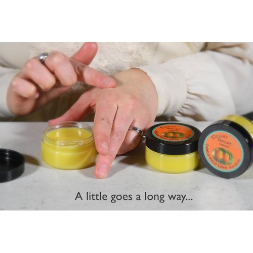 Orange Jojoba Oil Hand Salve. Over 50% Pure Organic Jojoba Oil. Moisturizes Hair, skin, face, hands, feet naturally. Softening formula with Organic Beeswax and Organic Avocado Oil.(2 oz/60gm)