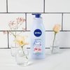 NIVEA Oil In Lotion Cherry Blossom & Jojoba Oil 400ml, Replenishing Body Lotion with Cherry Blossom & Jojoba Oil, Intensive Moisturising Cream