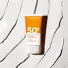 Clarins NEW Dry Touch Face Sunscreen | Broad Spectrum SPF 50+ | UVA/UVB Protection | Lightweight and No White Cast | Enriched with Antioxidants | All Skin Types, including Sensitive Skin | 1.7 Ounces