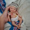 Reborn Baby Doll ，7 Inch Silicone Doll Girl ，Mini Realistic Newborn Baby Dolls Silicone Full Body Stress Relief with Feeding Accessories