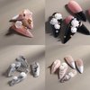 Tyuimhx Flowers Nail Charms 3D Resin White & Aurora Clear Rose Designs Nail Art Charms for Acrylic Nails Flatback Floral Nail Supplies for Women Girls DIY Manicure Decorations Crafts (6 Grids)